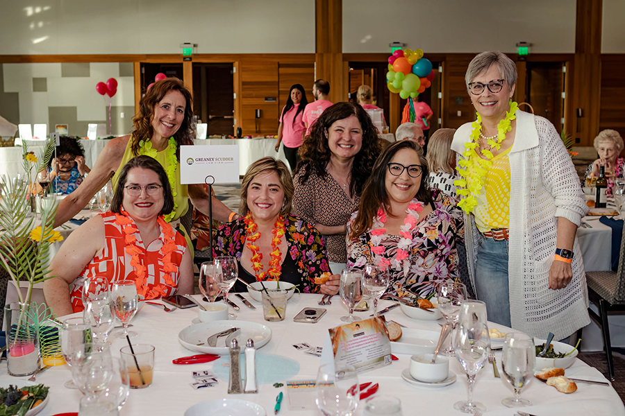 Women celebrating together at a festive dining event.