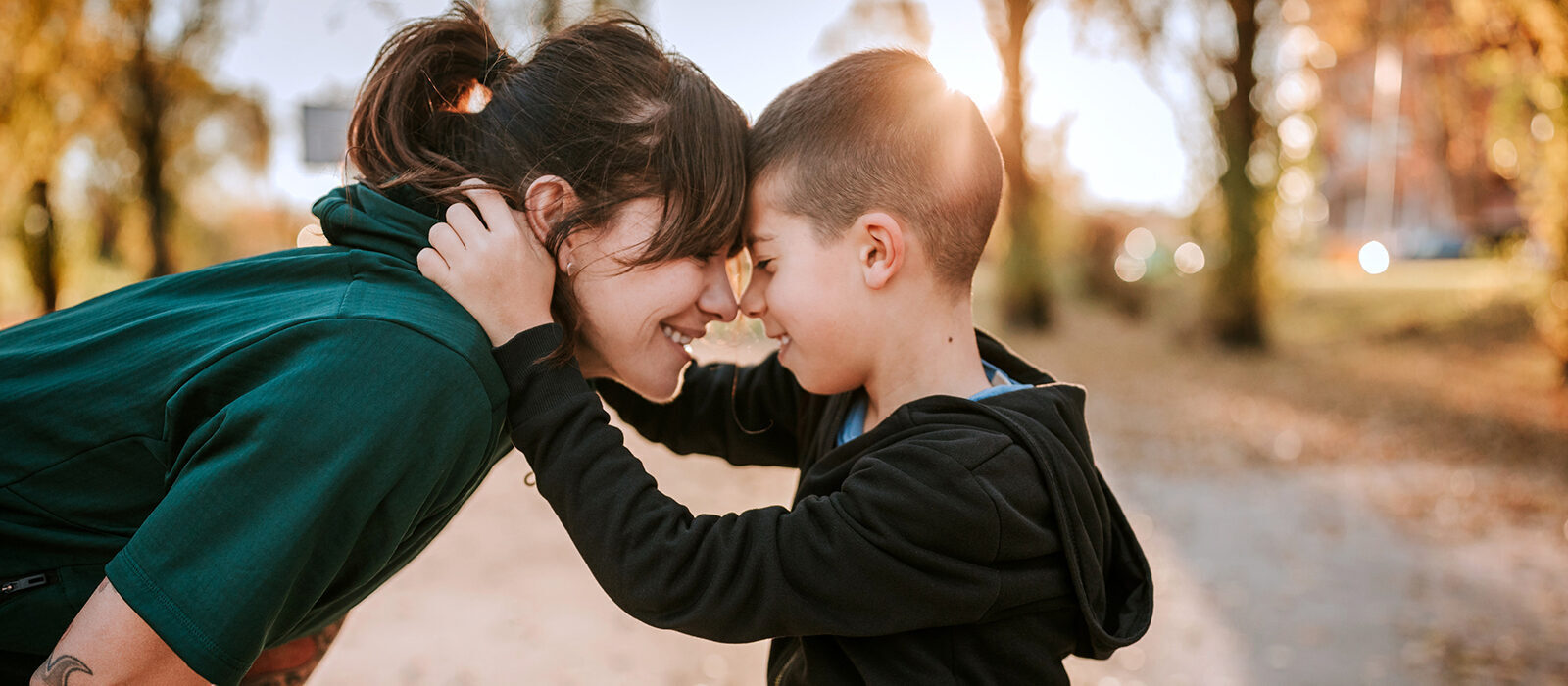A joyful moment between a woman and a boy.