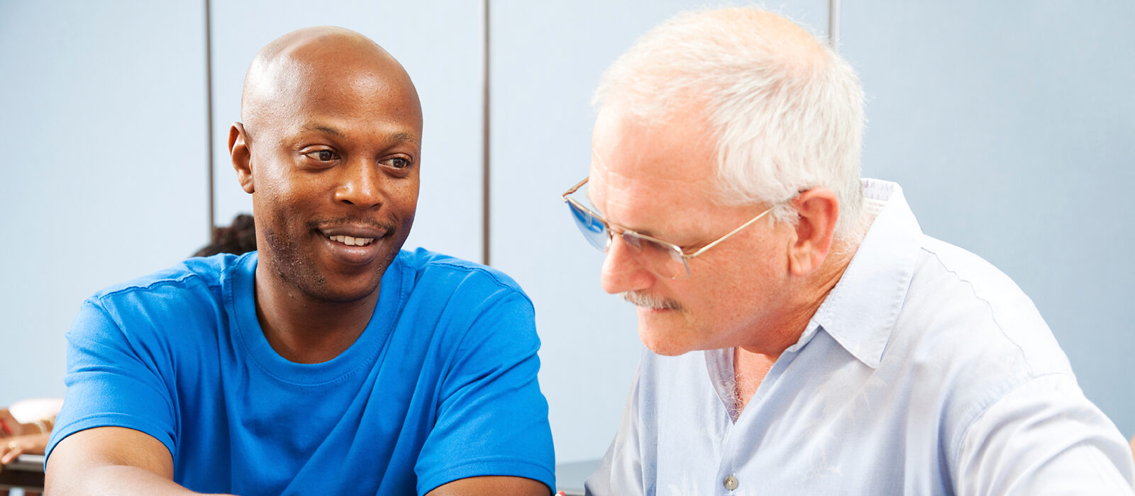 Two men engaged in a friendly conversation.